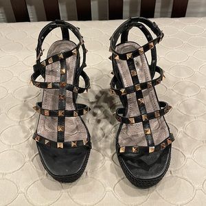 Never worn. Wedges with gold spikes.